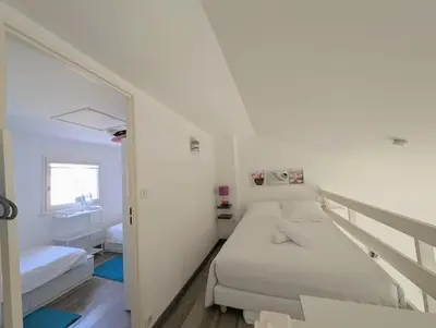 Un ou plusieurs lits dans un hébergement de l'établissement Maison dans résidence avec piscine et tennis - 4 personnes