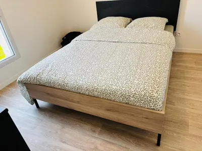 Un ou plusieurs lits dans un hébergement de l'établissement Chambre spacieuse et lumineuse chez l habitant