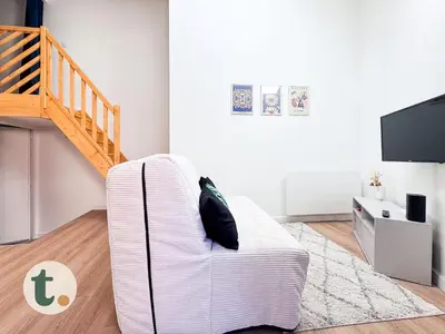 Coin salon dans l'établissement Tranquiloue - Petite Maison à 10 min du PuyduFou