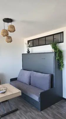 Coin salon dans l'établissement Appartement de charme, face à l'ocean
