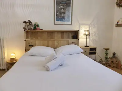 Un ou plusieurs lits dans un hébergement de l'établissement PROCE - Apt lumineux et cosy, vue parc de Procé