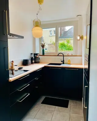 Cuisine ou kitchenette dans l'établissement M La Madeleine L'Appartement