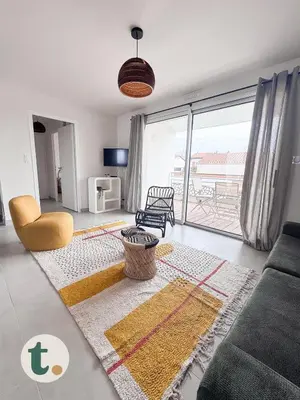 Coin salon dans l'établissement Tranquiloue - Appartement neuf proche PuyduFou !