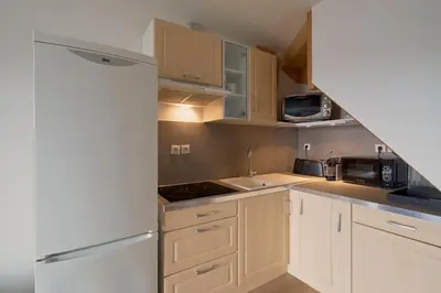 Cuisine ou kitchenette dans l'établissement La Source - A 20 minutes à pied du centre