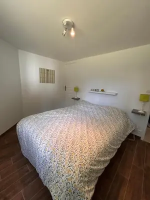 Un ou plusieurs lits dans un hébergement de l'établissement Maison Familiale Chaleureuse à Deux Pas de la Plage