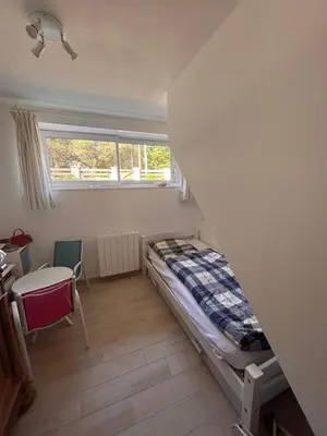 Un ou plusieurs lits dans un hébergement de l'établissement Maison Familiale Chaleureuse à Deux Pas de la Plage