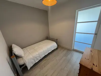 Un ou plusieurs lits dans un hébergement de l'établissement Appartement vue océan