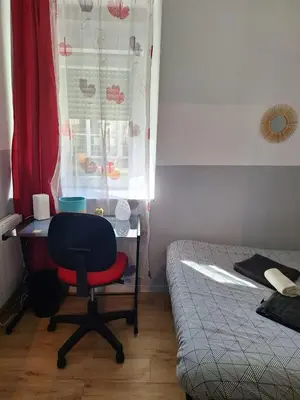 Un ou plusieurs lits dans un hébergement de l'établissement Au Cœur De Chateaubriant WIFI-Centre-Ville-RDC