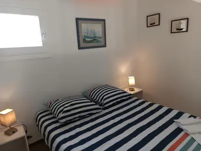 Un ou plusieurs lits dans un hébergement de l'établissement Maison cosy avec terrasse et accès piscine, Notre-Dame-de-Monts - 4 pers - FR-1-540-316