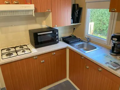 Cuisine ou kitchenette dans l'établissement Mobile home