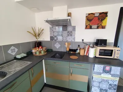 Cuisine ou kitchenette dans l'établissement Meublé cosy tt confort, arrivée autonome, proche Cholet et puy du f