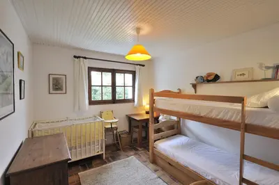 Un ou plusieurs lits dans un hébergement de l'établissement La Maison de Flo