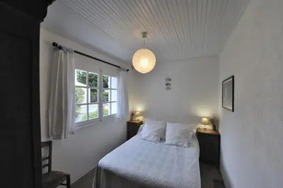 Un ou plusieurs lits dans un hébergement de l'établissement La Maison de Flo