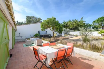 Balcon ou terrasse dans l'établissement Maison de plage 5 étoiles avec Spa