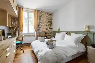 Un ou plusieurs lits dans un hébergement de l'établissement Le Jardin Secret - 2 chambres & Parking Offert