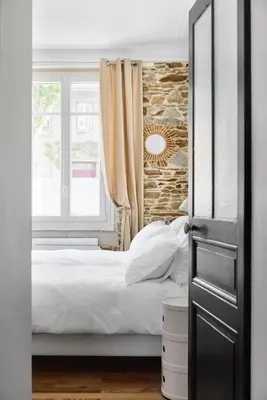 Un ou plusieurs lits dans un hébergement de l'établissement Le Jardin Secret - 2 chambres & Parking Offert