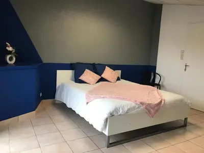 Un ou plusieurs lits dans un hébergement de l'établissement Gite La Villa des Coeurs Vendéens