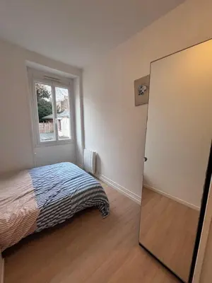 Un ou plusieurs lits dans un hébergement de l'établissement Spacieux Appartement Privé T2 rénové