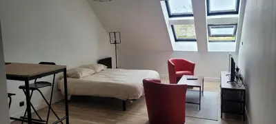 Un ou plusieurs lits dans un hébergement de l'établissement Studio Blain centre ville