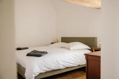 Un ou plusieurs lits dans un hébergement de l'établissement Pied à Terre