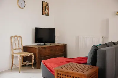 Télévision ou salle de divertissement dans l'établissement Pied à Terre