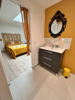 Un ou plusieurs lits dans un hébergement de l'établissement Chambres d'hôtes LA GRANGE DU PA de LA GROLLE