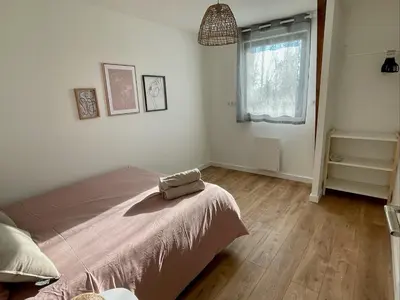 Un ou plusieurs lits dans un hébergement de l'établissement Spacious house for up to 10 people in Vertou