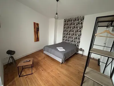 Un ou plusieurs lits dans un hébergement de l'établissement Jolie maison familiale 14 personnes
