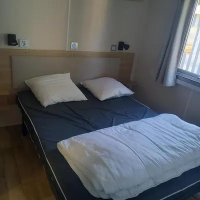 Un ou plusieurs lits dans un hébergement de l'établissement Mobil-home Saint Jean de mont