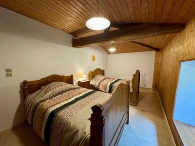 Un ou plusieurs lits dans un hébergement de l'établissement Grande Maison au Calme