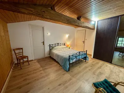 Un ou plusieurs lits dans un hébergement de l'établissement Grande Maison au Calme