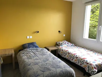 Un ou plusieurs lits dans un hébergement de l'établissement Balcon sur l'èvre