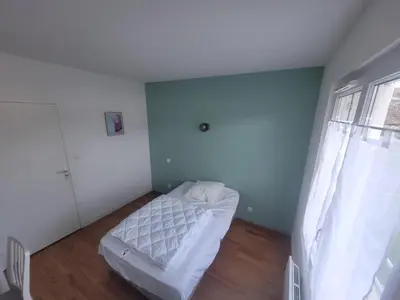 Un ou plusieurs lits dans un hébergement de l'établissement Appartement bord de mer, T4