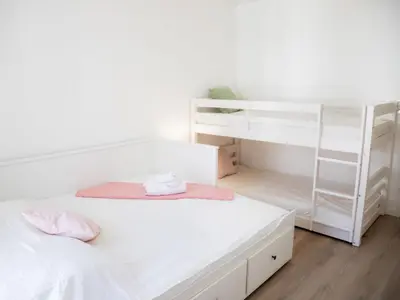 Un ou plusieurs lits dans un hébergement de l'établissement Apartment Atlantica-3 by Interhome