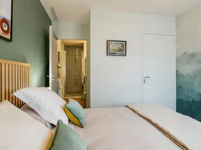 Un ou plusieurs lits dans un hébergement de l'établissement Bel appartement en bord de mer avec terrasse et parking - FR-1-306-1298