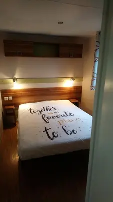 Un ou plusieurs lits dans un hébergement de l'établissement Mobil home camping 4 étoile