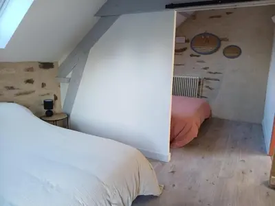 Un ou plusieurs lits dans un hébergement de l'établissement Gîte les 3 petits porcelets