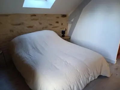 Un ou plusieurs lits dans un hébergement de l'établissement Gîte les 3 petits porcelets