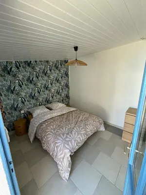 Un ou plusieurs lits dans un hébergement de l'établissement MYRTILLE - Maison 6 personnes avec jardin à 100m de la plage