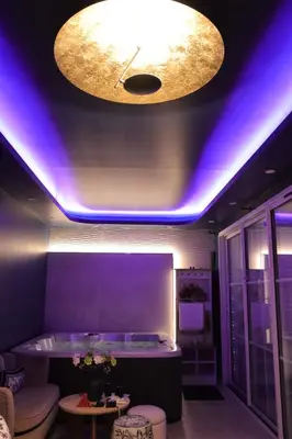 Coin salon dans l'établissement Suite Jacuzzi privatif Li Li et Rose