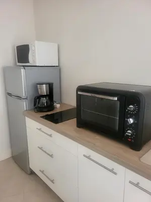 Cuisine ou kitchenette dans l'établissement La maison de Marie