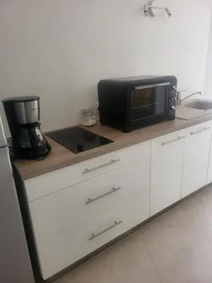 Cuisine ou kitchenette dans l'établissement La maison de Marie