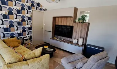 Coin salon dans l'établissement Le Domaine de la Haye - Gîtes
