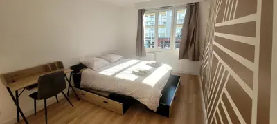 Un ou plusieurs lits dans un hébergement de l'établissement Appartement Hyper-Centre 3 Chambres 3 Salles de Bain Parking