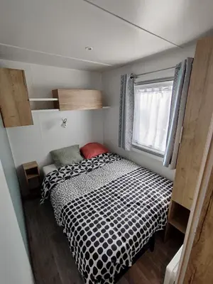 Un ou plusieurs lits dans un hébergement de l'établissement Mobil-home 3 chambres