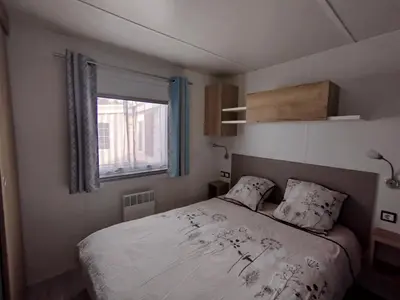Un ou plusieurs lits dans un hébergement de l'établissement Mobil-home 3 chambres
