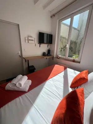 Un ou plusieurs lits dans un hébergement de l'établissement STUDIO CENTRE VILLE ANGERS RDC - 2 personnes