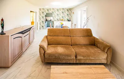 Coin salon dans l'établissement Cozy Home In Notre Dame De Riez