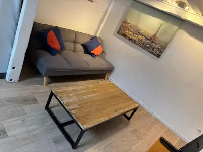 Coin salon dans l'établissement Joli logement très accueillant