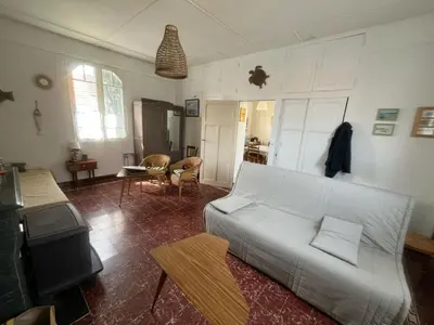 Un ou plusieurs lits dans un hébergement de l'établissement Maison avec jardin à 150 m de la plage